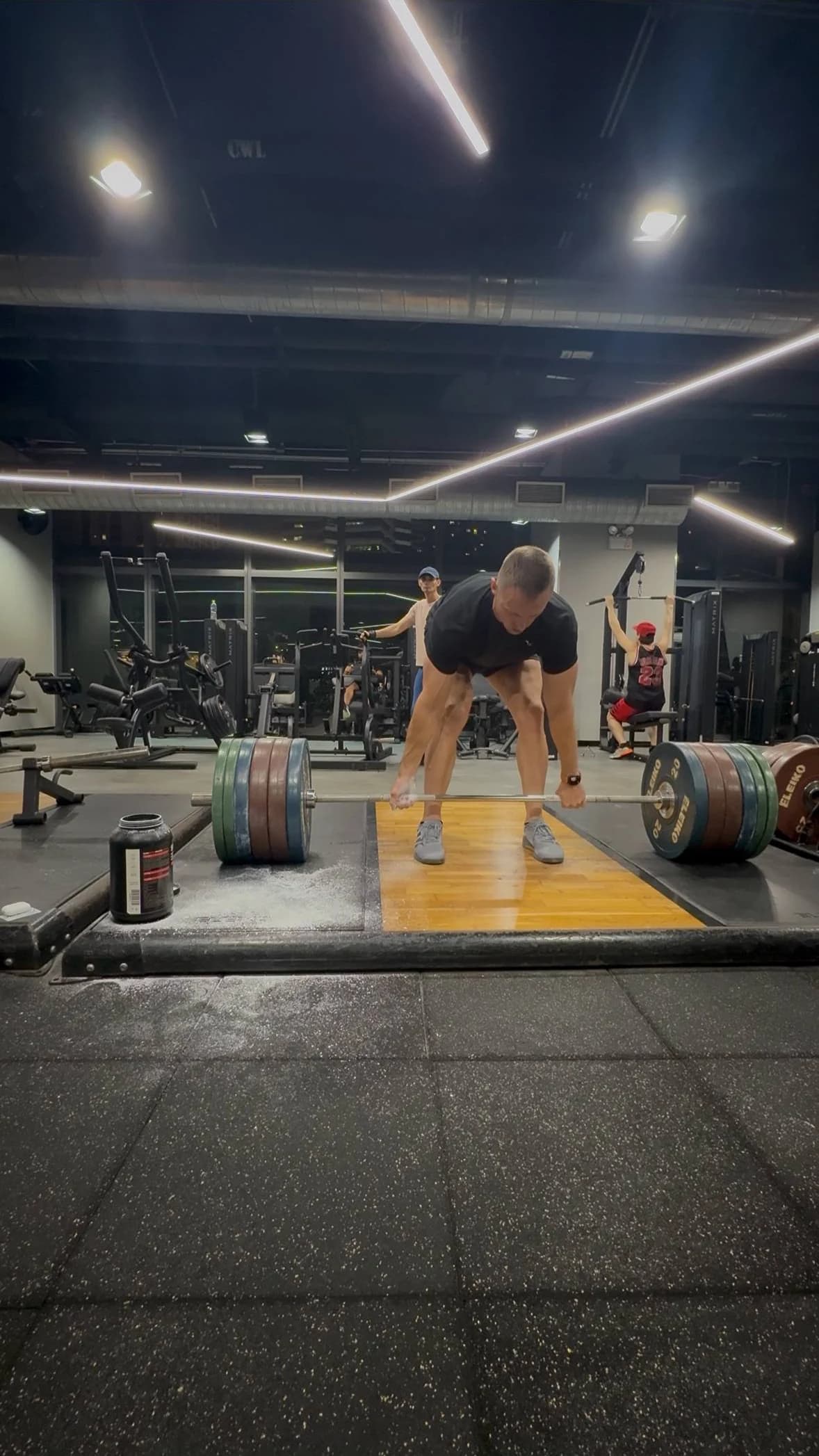 Spencer Tarring training with a loaded barbell
